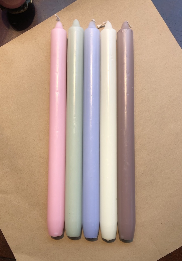 A package with 10 pastel coloured candles