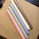 A package with 10 pastel coloured candles