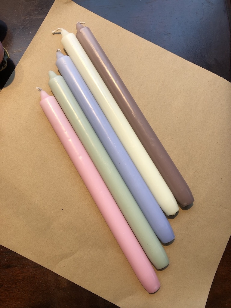 A package with 10 pastel coloured candles