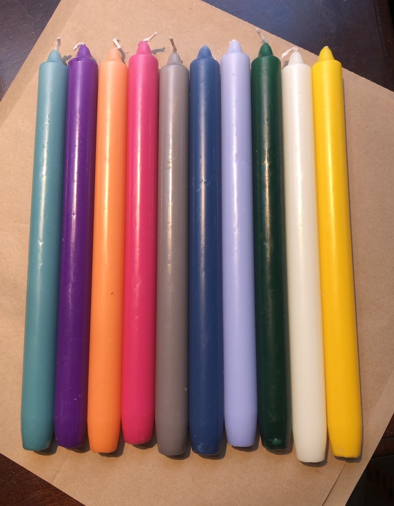 A package with 10 candles in 10  different colours