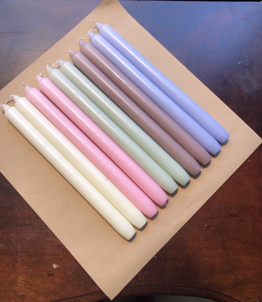 A package with 10 pastel coloured candles