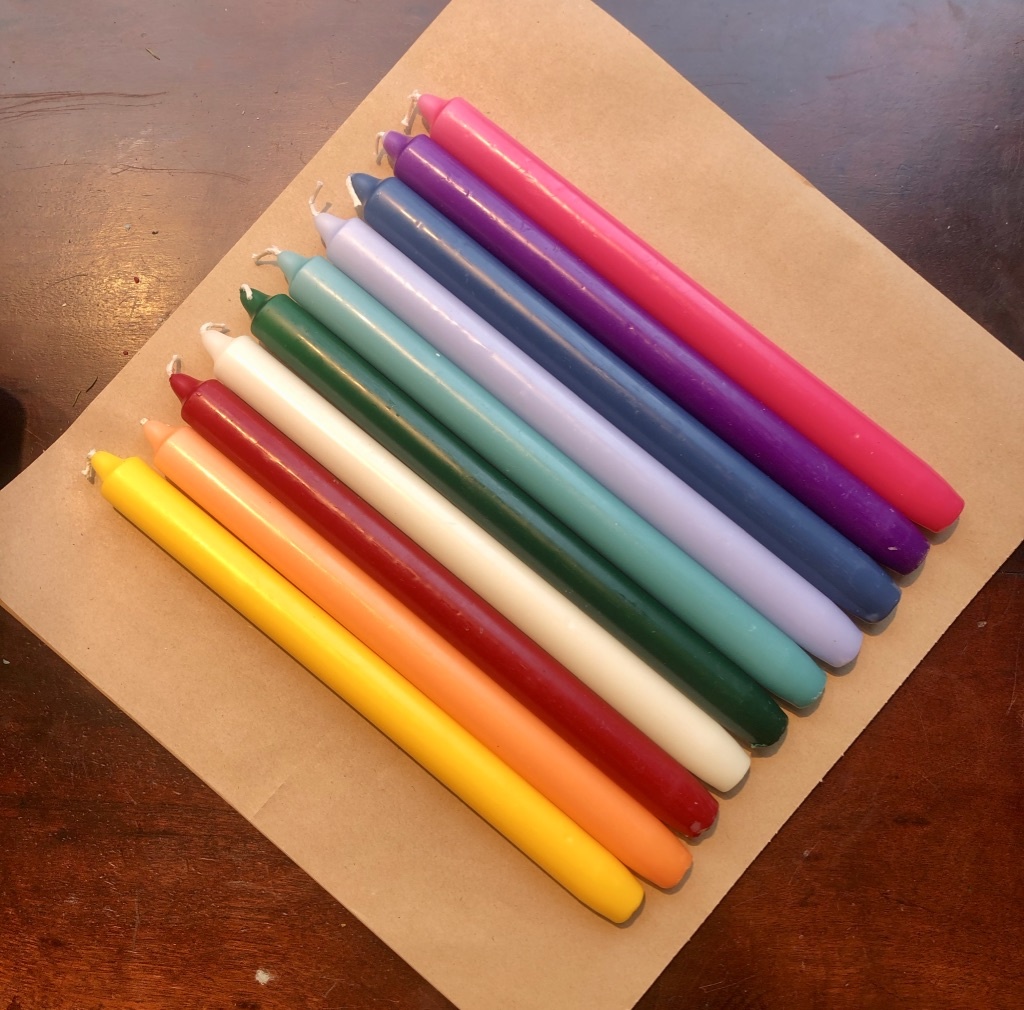 A package with 10 candles in 10  different colours