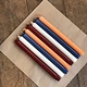 A package of 10 candles in the colours of the Dutch Flag.