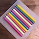 A package with 10 candles in colours that light up your summer