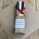 A package with 10 candles, red,  green , ivory and old ivory for Christmas