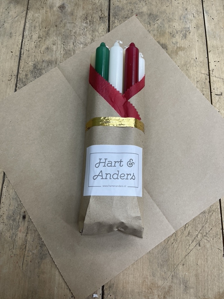 A package with 10 candles, red,  green , ivory and old ivory for Christmas
