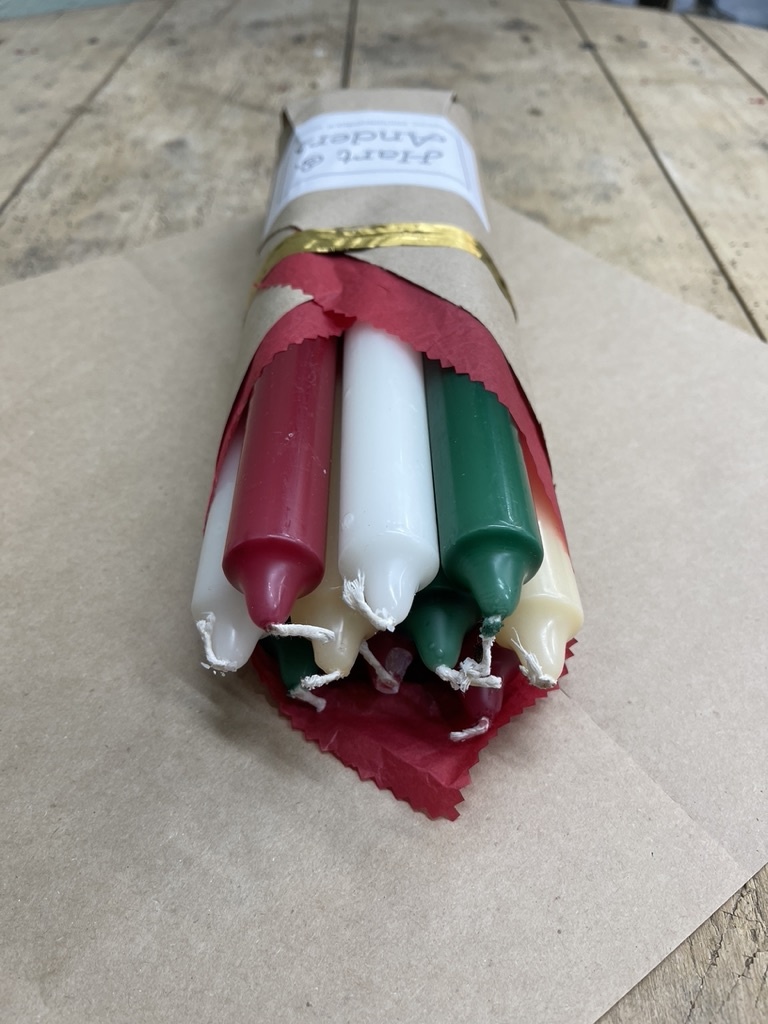 A package with 10 candles, red,  green , ivory and old ivory for Christmas