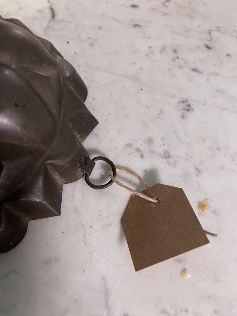 Antique backing tin or pudding tin with hanging hook