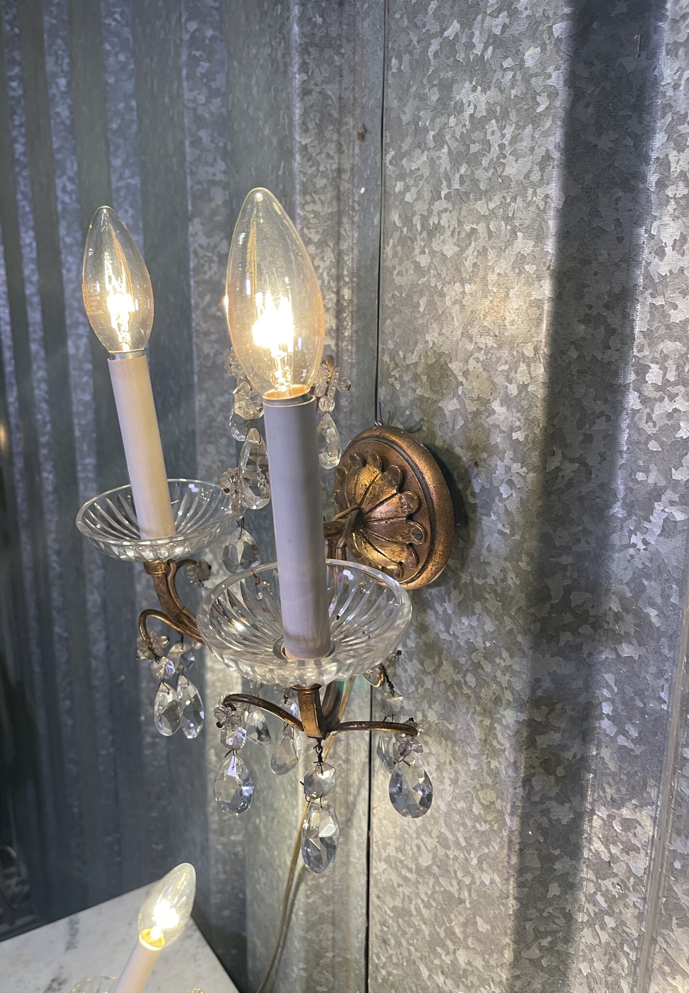 Set of three vintage wall sconces with glass pendant drops