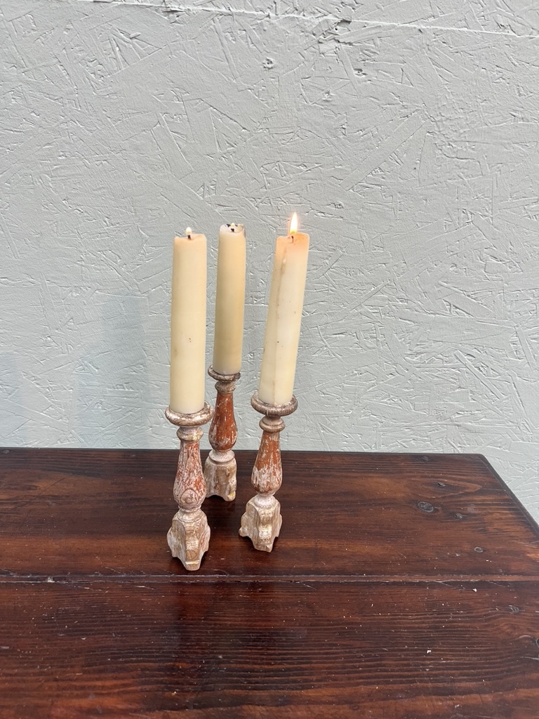Antique tiny church candlesticks with traces of the old paint