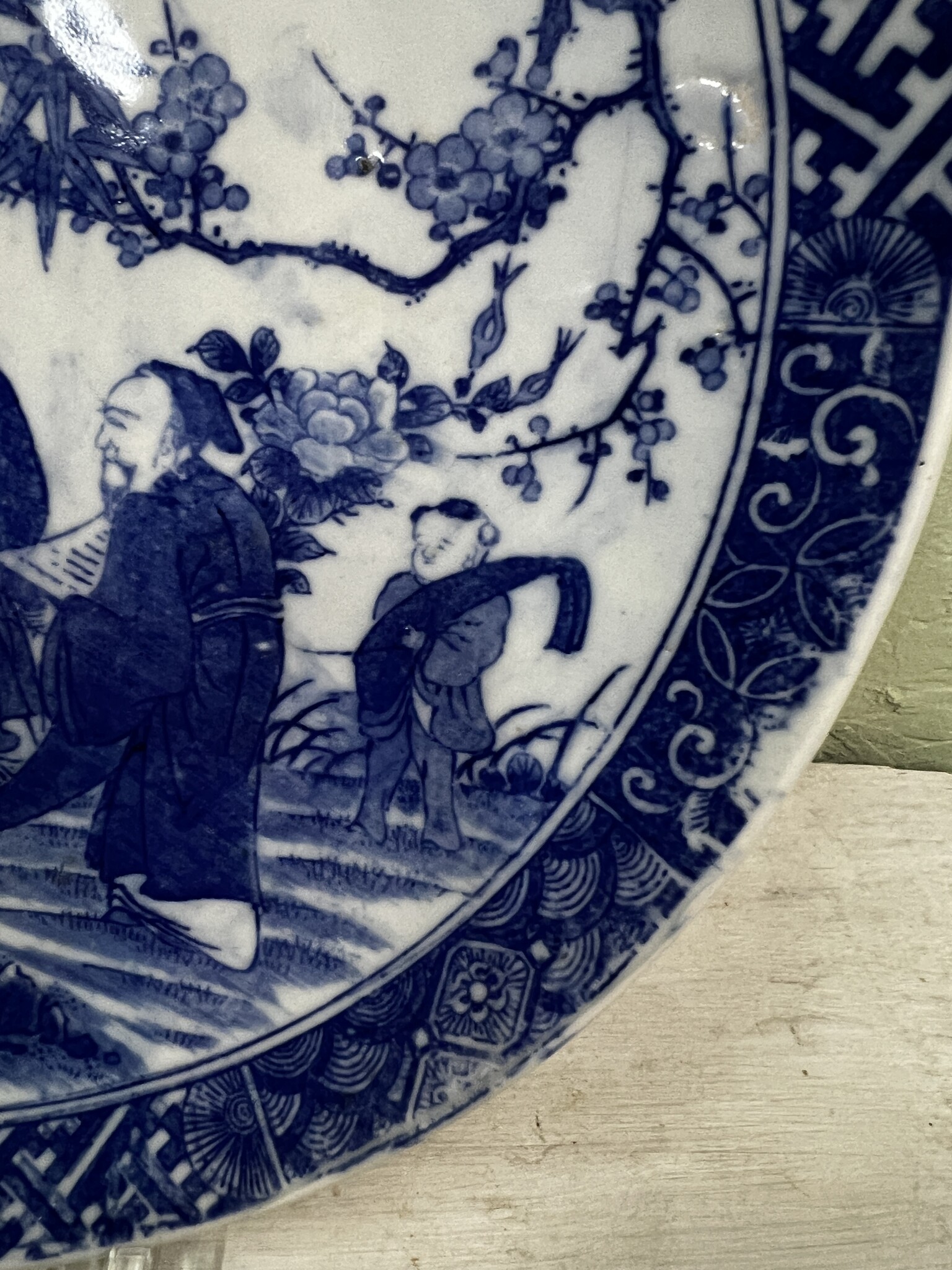 Antique plate with blue decoration with Japanese men