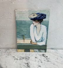 Lady with a hat on the boulevard