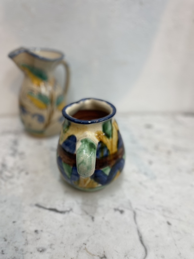 Brightly coloured stone ware pitcher