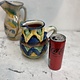 Brightly coloured stone ware pitcher