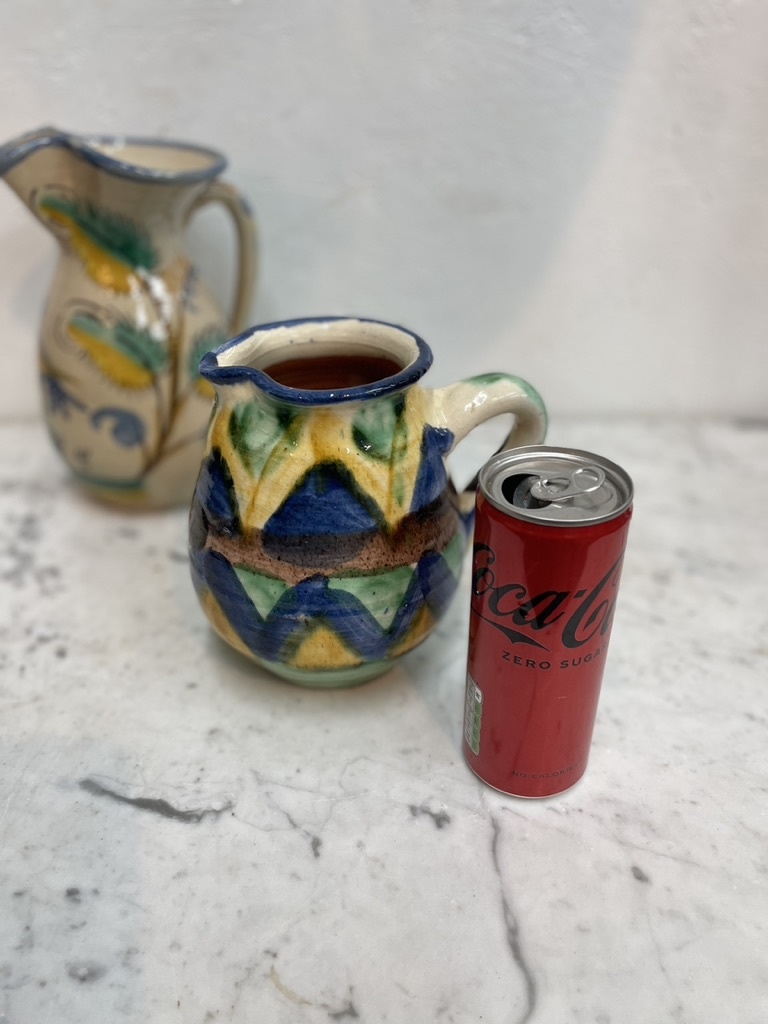 Brightly coloured stone ware pitcher
