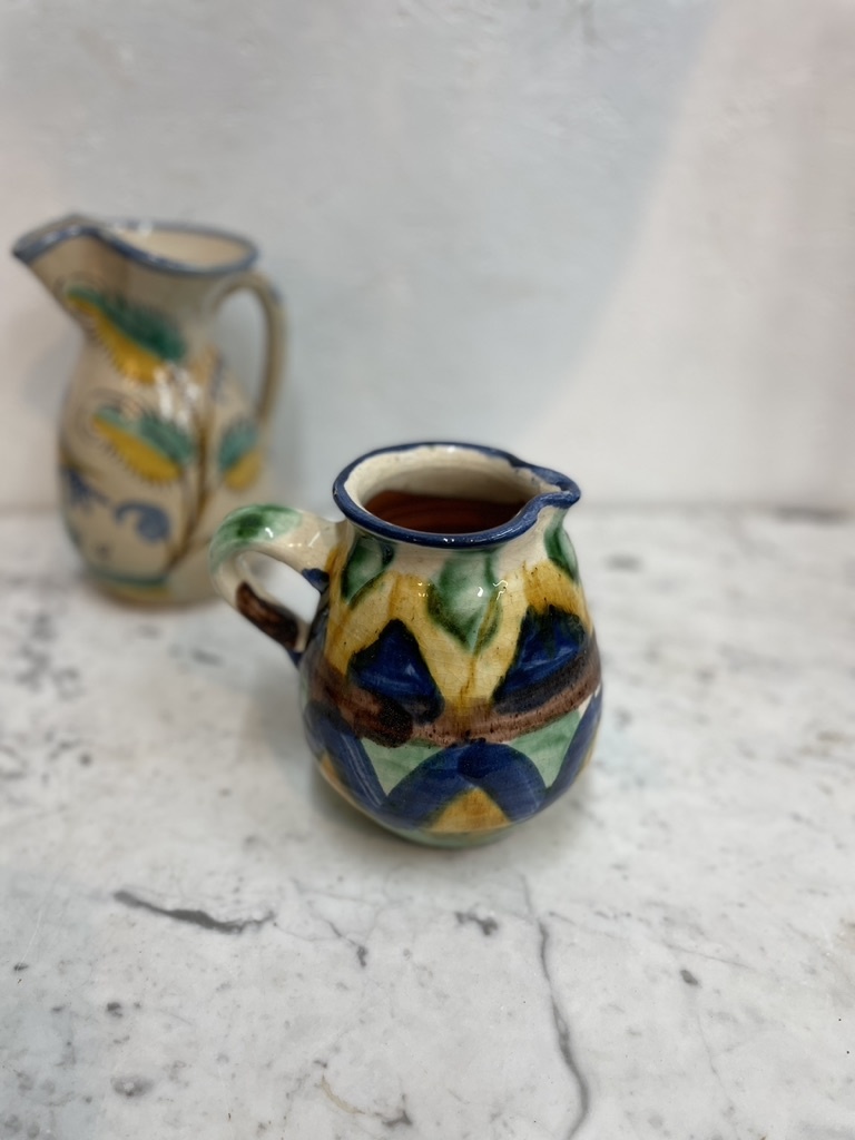 Brightly coloured stone ware pitcher