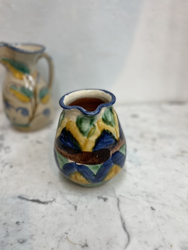 Brightly coloured stone ware pitcher