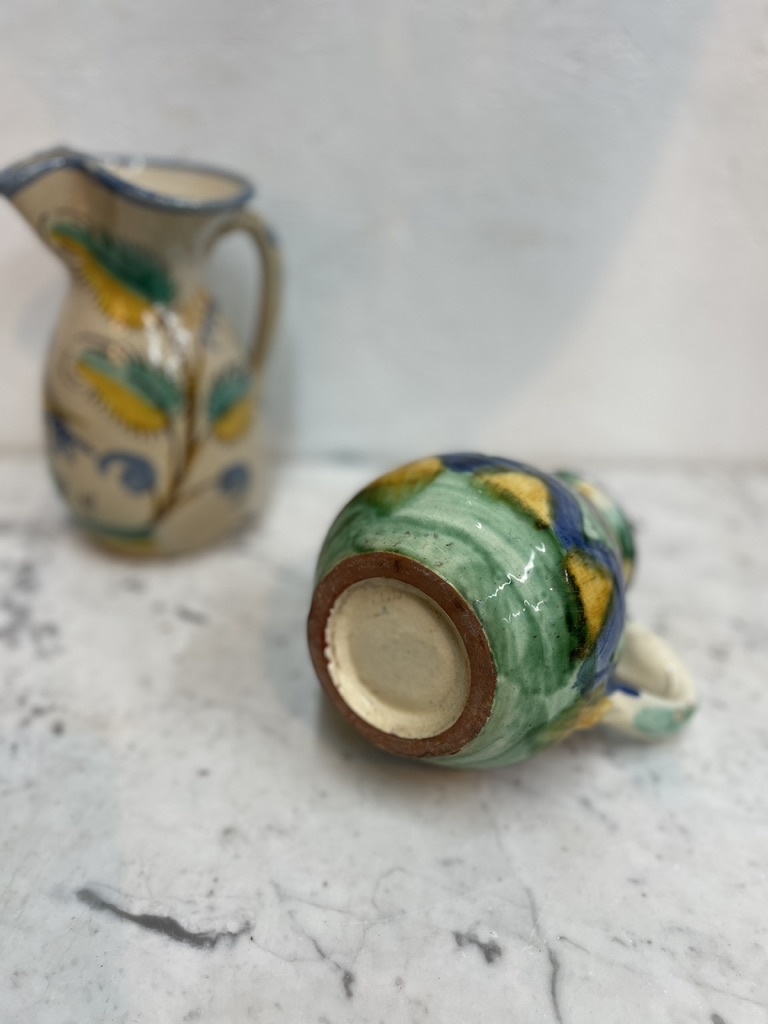 Brightly coloured stone ware pitcher