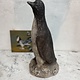 Vintage garden statue of a proud penguin.