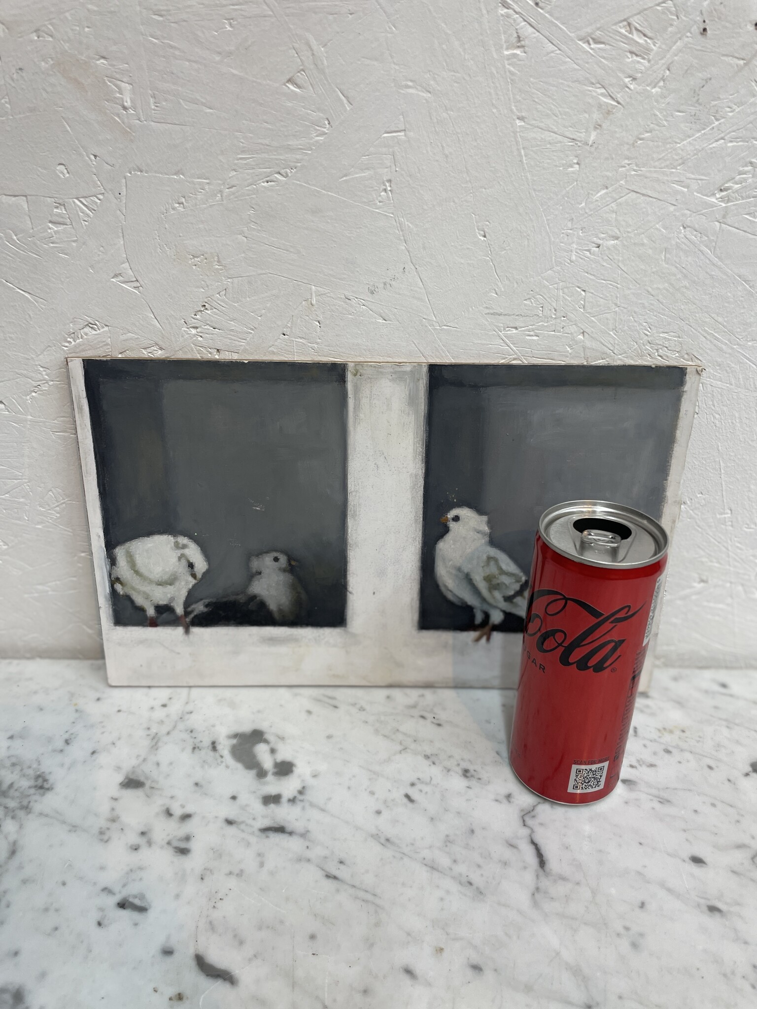 Schilderij van witte duifjes in een hokje