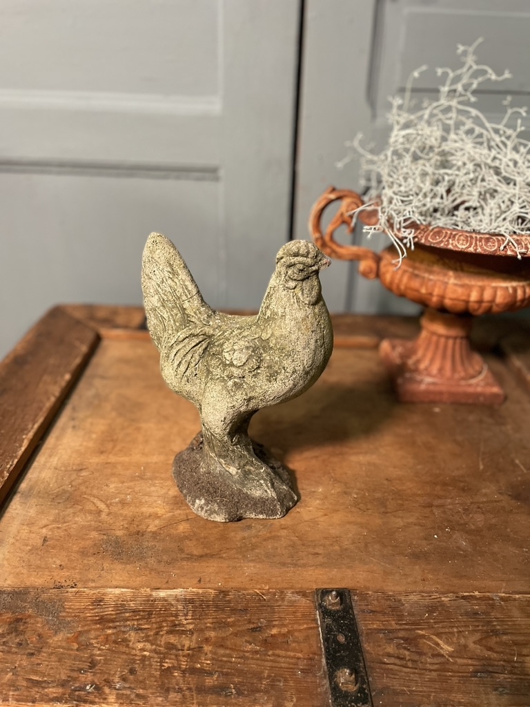 Vintage garden statue of a perky little rooster