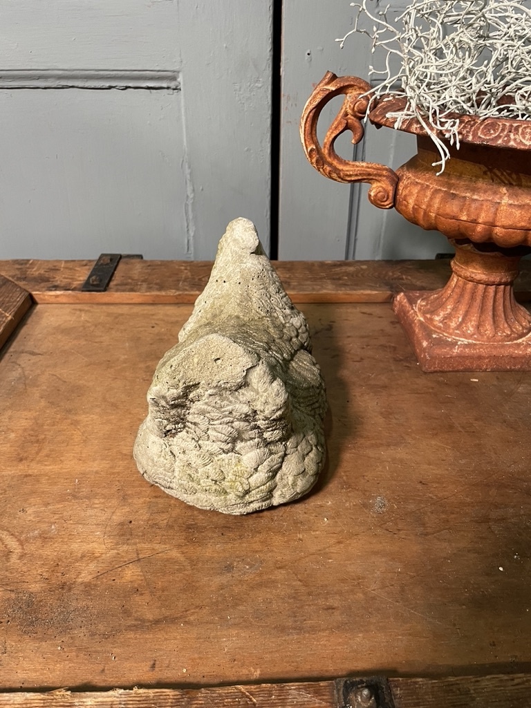 Vintage garden statue brooding chicklet