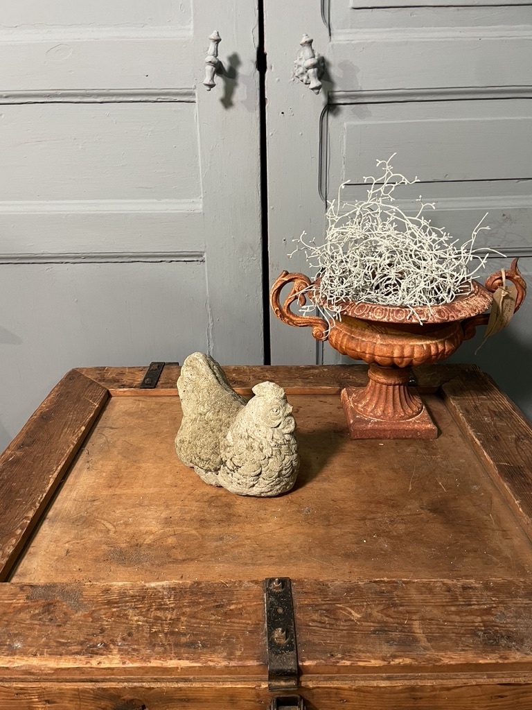 Vintage garden statue brooding chicklet