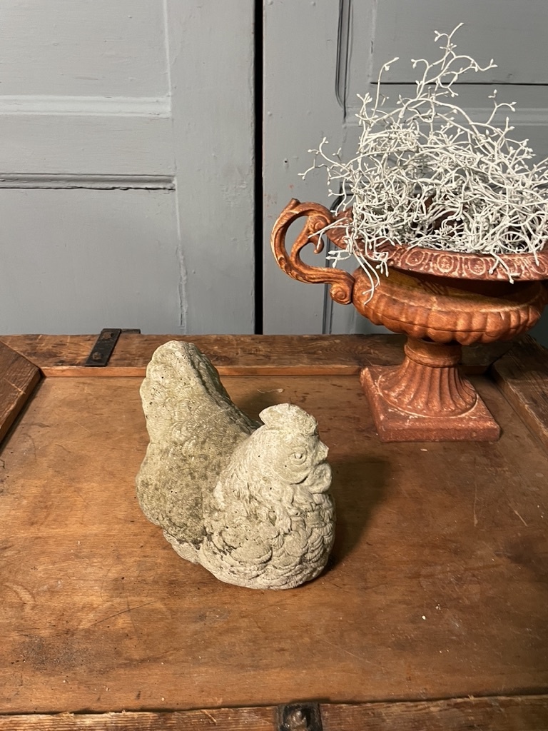 Vintage garden statue brooding chicklet