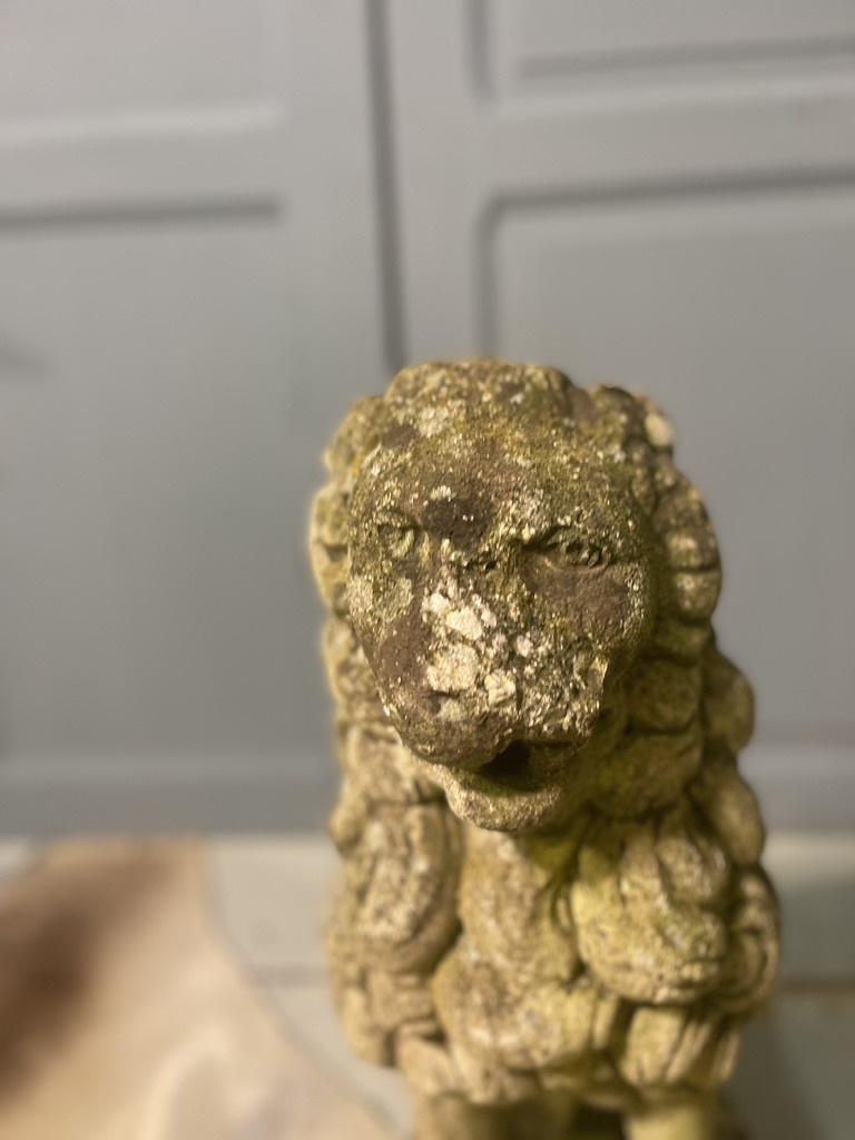 Almost antique garden statue, sitting lion
