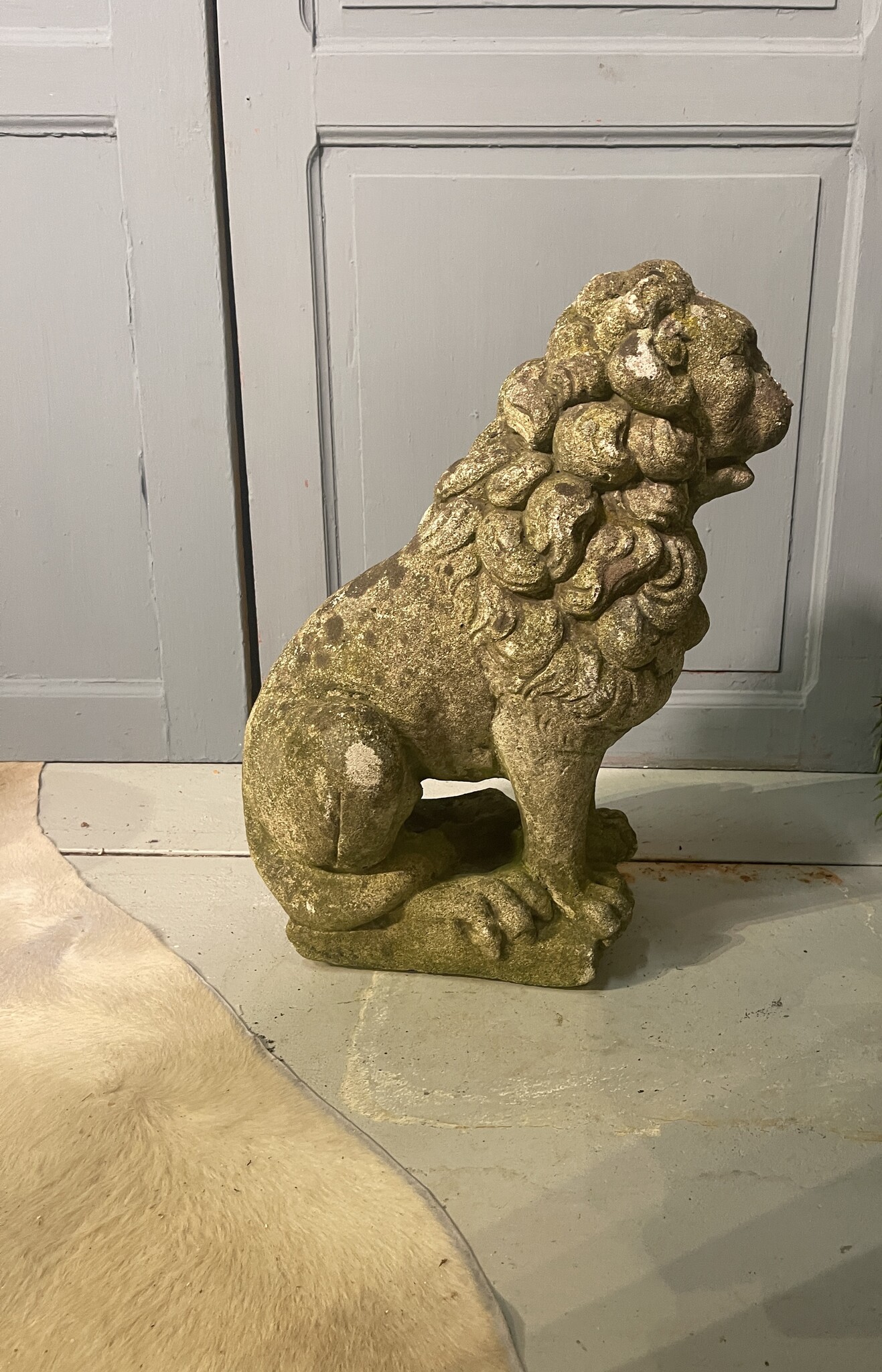 Almost antique garden statue, sitting lion