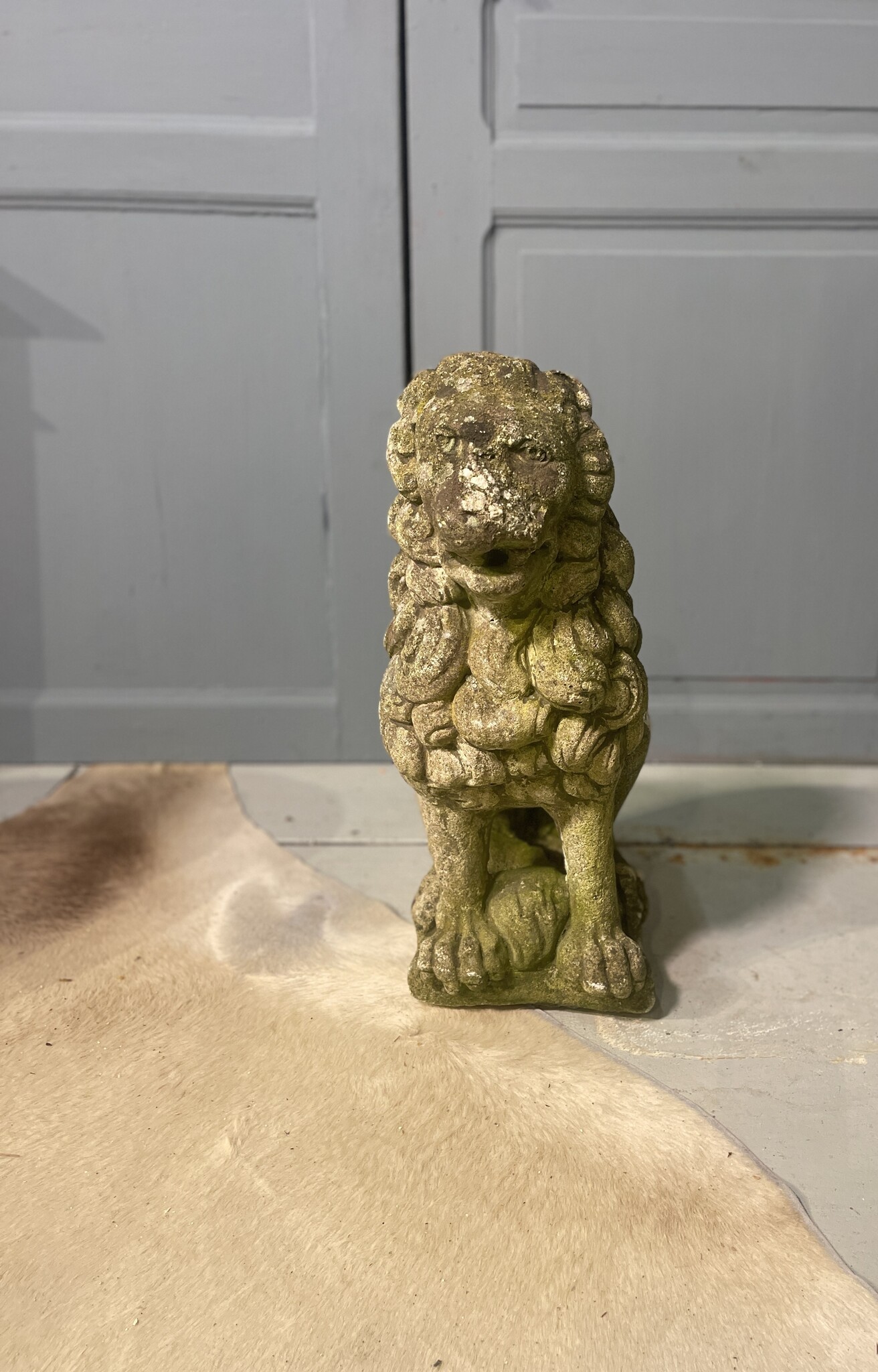 Almost antique garden statue, sitting lion