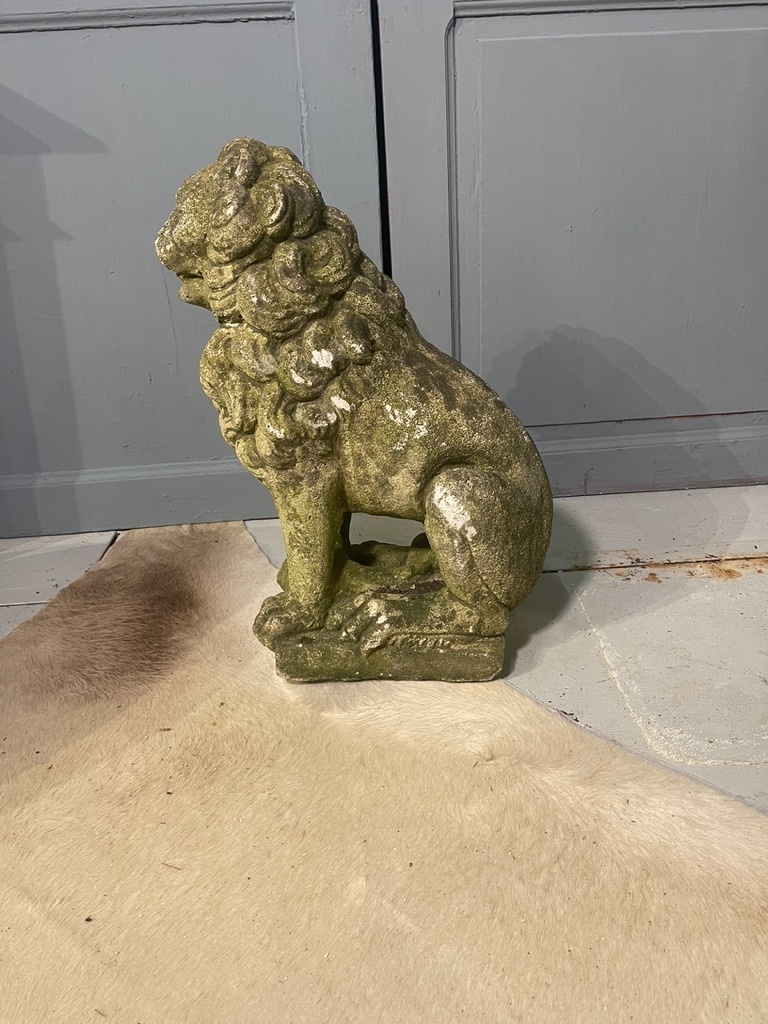 Almost antique garden statue, sitting lion