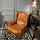 Almost antique leather wingback armchair with charming details