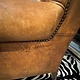 Almost antique leather wingback armchair with charming details