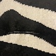 Zebra rug with fringe