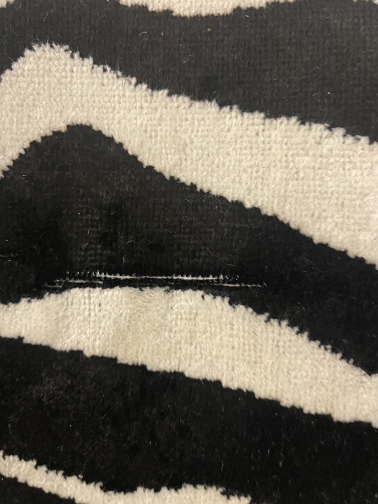 Zebra rug with fringe