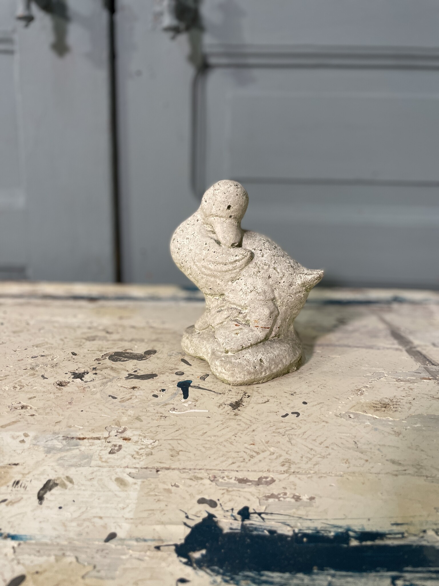 Sweet garden statue of a shy little duck