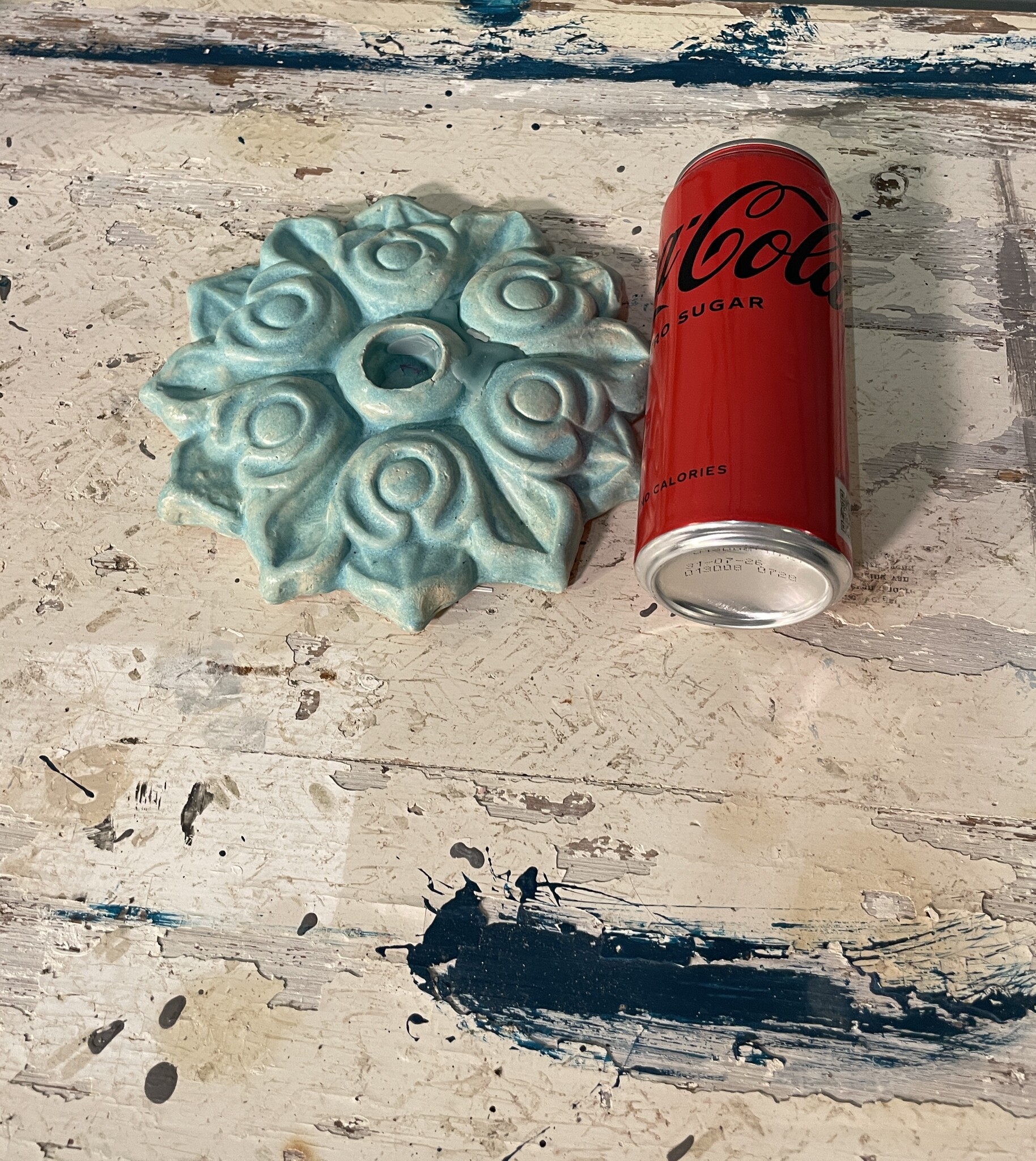 Handcrafted ceramic candle holder made from a wall iron