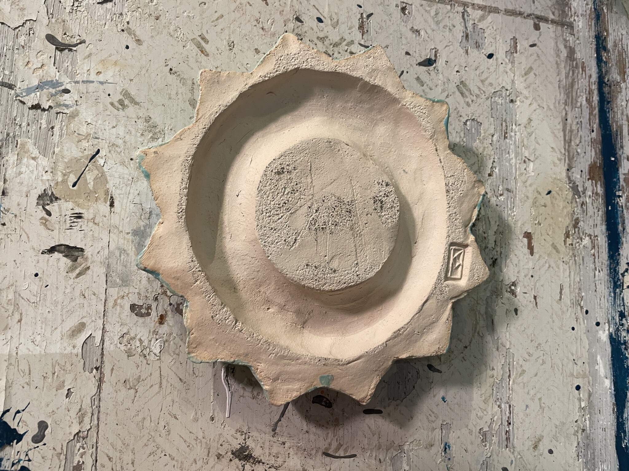Handcrafted ceramic candle holder made from a wall iron