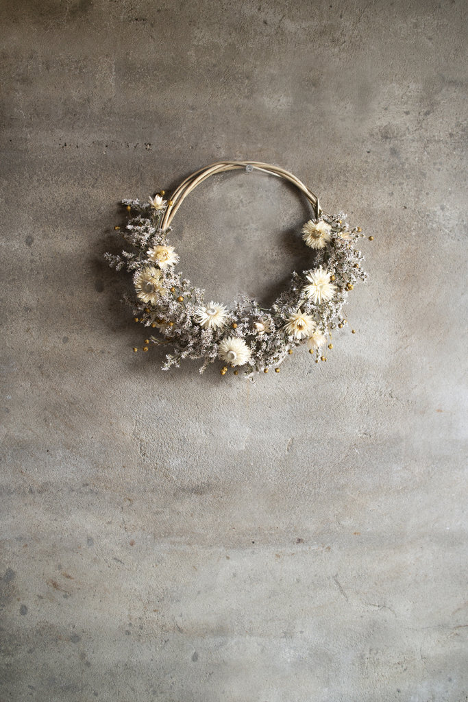 Light-colored flower wreath with dried flowers