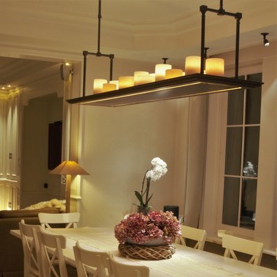 Hoe hoog hang je een lamp boven de eettafel?