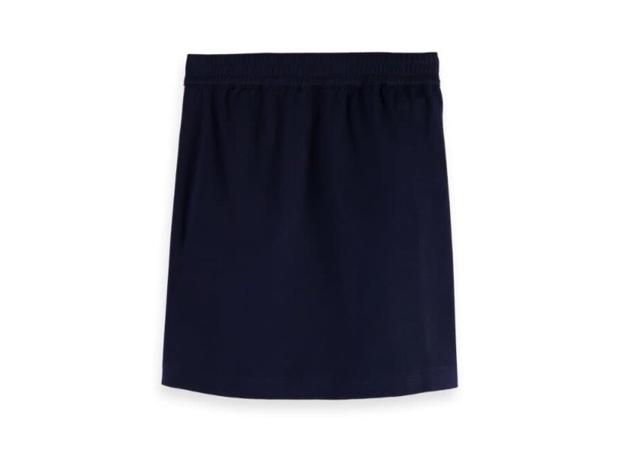 Classic clean jersey skirt with shell buttons