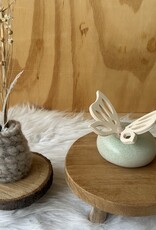 Urn met houten vlinder