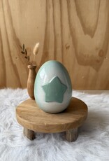 Urn met mintgroene ster
