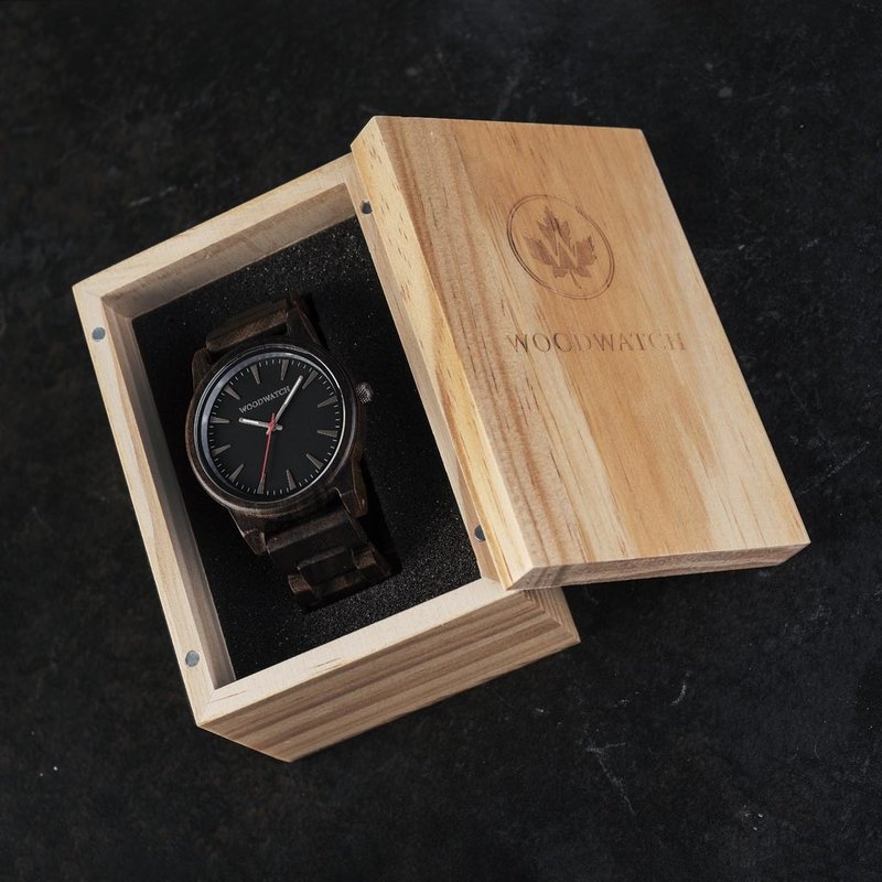 The Cypher Sandal features a modernized minimal black dial with bold details in a 45mm case. A wrist essential combining natural wood with stainless steel and sapphire coated glass. The Cypher Sandal is handmade from natural Black Sandalwood from East Afr