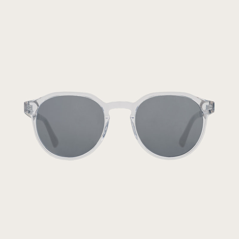 The REVELER Clear Smoke features a sleek geometric clear frame with grey smoke lenses Composed of durable Italian Mazzucchelli bio-acetate with hand-finished natural senna siamea wood temples and nude acetate tips. Bio-acetate is made from cotton and orga