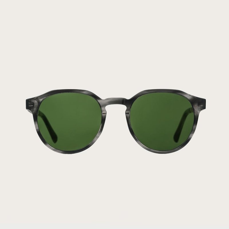 The REVELER Heritage Camo features a sleek geometric grey tortoise frame with green camo lenses. Composed of durable Italian Mazzucchelli bio-acetate with hand-finished natural zebrawood temples and tortoise acetate tips. Bio-acetate is made from cotton a