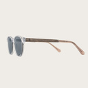 The ELLIPSE Clear Smoke features a characteristic rounded clear frame with grey smoke lenses Composed of durable Italian Mazzucchelli bio-acetate with hand-finished natural senna siamea wood temples and nude acetate tips. Bio-acetate is made from cotton a