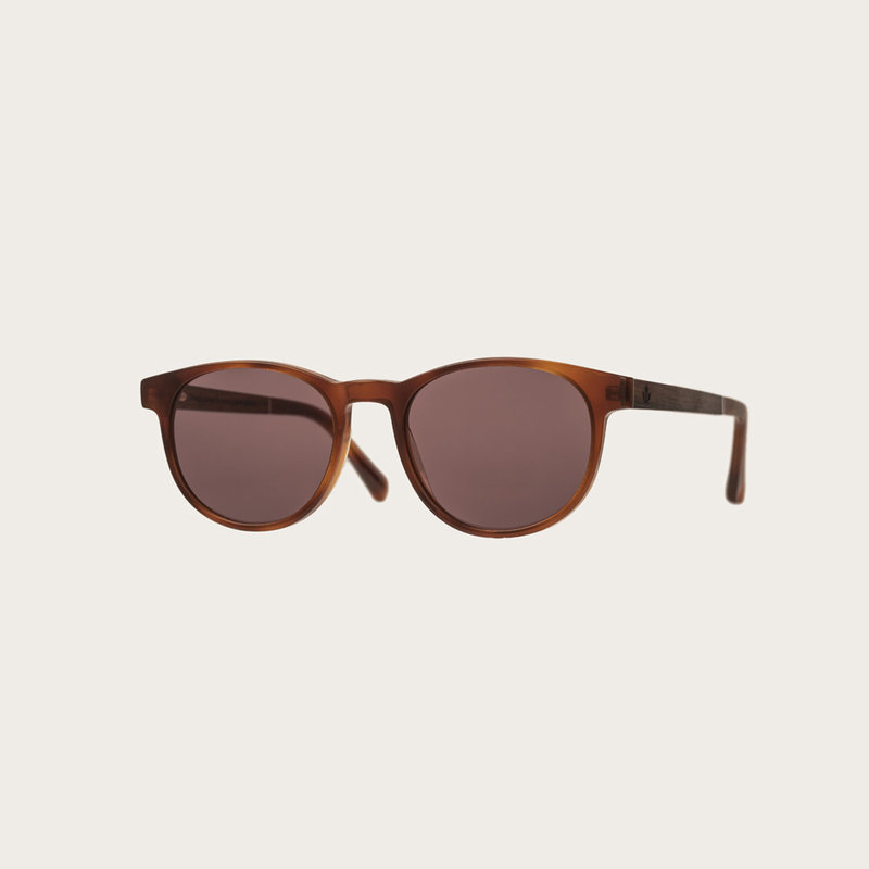 The ELLIPSE Classic Havanas Brown features a characteristic rounded dark yellow tortoise frame with mocha brown lenses. Composed of durable Italian Mazzucchelli bio-acetate with hand-finished natural ebony temples and tortoise acetate tips. Bio-acetate is