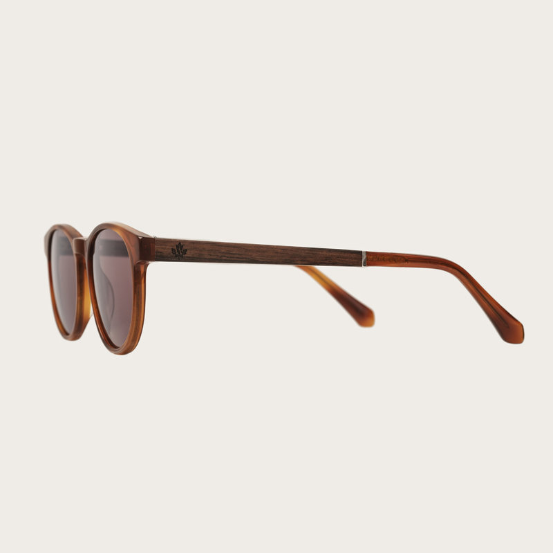 The ELLIPSE Classic Havanas Brown features a characteristic rounded dark yellow tortoise frame with mocha brown lenses. Composed of durable Italian Mazzucchelli bio-acetate with hand-finished natural ebony temples and tortoise acetate tips. Bio-acetate is